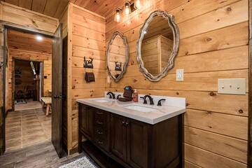 Double sinks in your cabin's 1st bedroom.