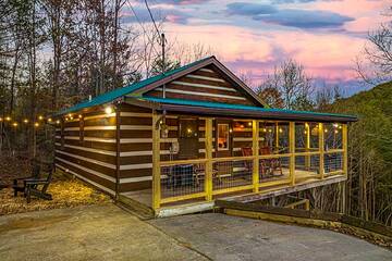 Cabin lights begin to glow in the Smokies sunset. at Moonlight Obsession in Gatlinburg TN