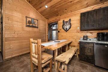 Cabin log dining table for 5 people.