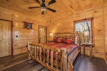2nd bedroom with a relaxing king sized log bed.
