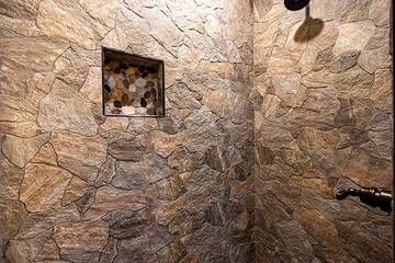 Step into the stone shower of your 2nd bedroom.