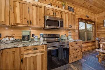 Your cabin's kitchen has all the amenities of home.