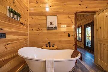 Chill in your cabin rental's clawfoot bathtub.