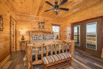 Smokies cabin's second bedroom with log bed.
