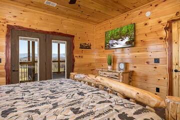 Enjoy late night tv and sunsets from your log bed.