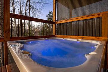 Your cabin offers a soft lighted romantic hot tub.