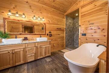 Your rental cabin's master bath with clawfoot bathtub.