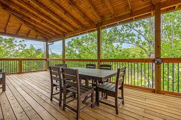 Outside dining table on your cabin's porch.