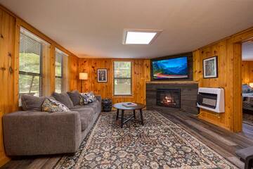 Angled phot of your rental cabin living room. at Pigeon Forge Getaway in Gatlinburg TN