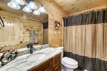 Fourth bathroom with tub - shower combo. at Enchanted Spirit in Gatlinburg TN
