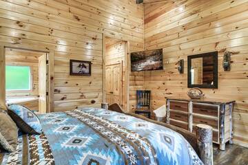 Spacious cabin bedroom with television. at Enchanted Spirit in Gatlinburg TN
