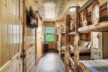 Double bunks in tour cabin rental's sixth bedroom. at Enchanted Spirit in Gatlinburg TN