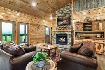 Cabin living room with gas log fireplace.