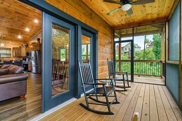 Tke in the beauty of the Smokies from your cabin rental's screened porch.