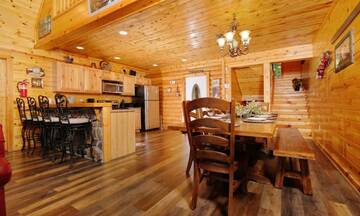 Large farm style in-cabin dining table.  at Applewood Manor in Gatlinburg TN