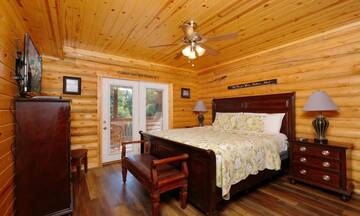 Relaxing spacious bedroom with walk-out to the covered porch. at Applewood Manor in Gatlinburg TN