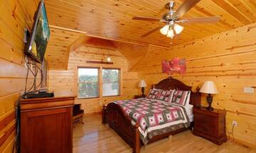 Log cabin's relaxing king sized bed. at Applewood Manor in Gatlinburg TN