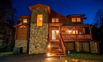 Night view of this beautiful 4BR rental cabin located across from Dollywood Theme Park.  at Applewood Manor in Gatlinburg TN
