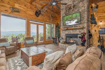 Enjoy the warmth of the double sided stacked stone fireplace.
