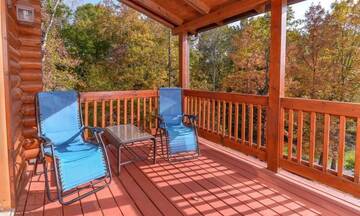 Applewood Manor, your rental cabin in the Smokies, features large porches with lots of outdoor furniture. at Applewood Manor in Gatlinburg TN