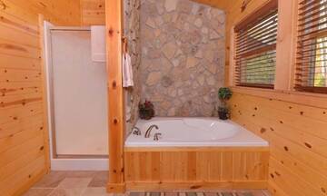 Shower or soak in the Jacuzzi tub at you cabin in the Smokies.