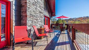 Take in the outdoors from your cabin's deck seating. at Stonehenge Cabin in Gatlinburg TN