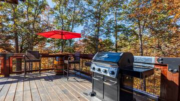Gas grill on your Sevierville cabin's large wrap around deck.