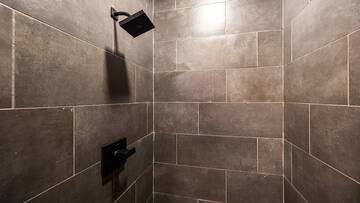 Take a relaxing shower underneath your cabin's rain water shower head.