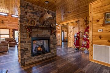 Warm glow from the cabin's double sided fireplace.