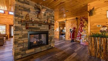 Christmas cabin rental with two sided fireplace.