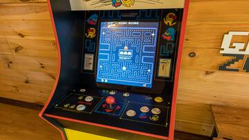 Cabin gameroom with Pac-Man arcade.