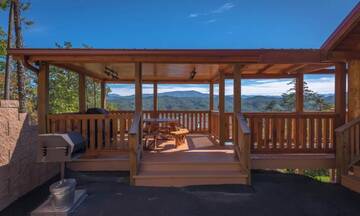Smoky Mountains cabin with covered picnic table and views. at A Point of View in Gatlinburg TN