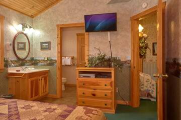 Television in your cabin's fourth bedroom. at Wrap Around The Son in Gatlinburg TN