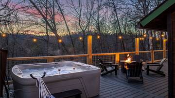 Your cabin offers a wonderful hot tub and gas fire pit. at Mountain Whispers in Gatlinburg TN