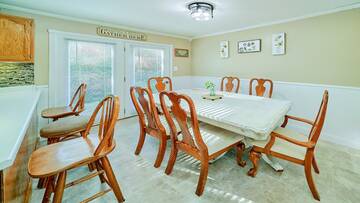 Dining table and breakfast bar at your vacation rental home.
