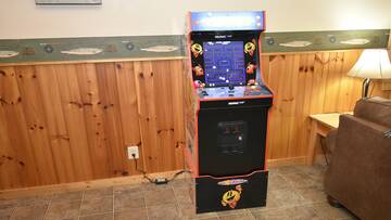 Family members and friends will enjoy the Pac Man multigame video arcade.  at Wrap Around The Son in Gatlinburg TN