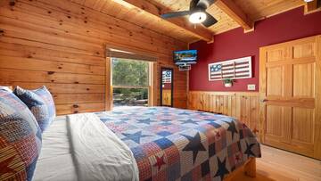 Watch late night shows from your bedroom's television. at Moonlight Pines Lodge in Gatlinburg TN