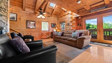 Main floor living room at your Smoky Mountains cabin. at Moonlight Pines Lodge in Gatlinburg TN