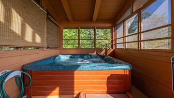 Screened in family sized hot tub.  at Moonlight Pines Lodge in Gatlinburg TN