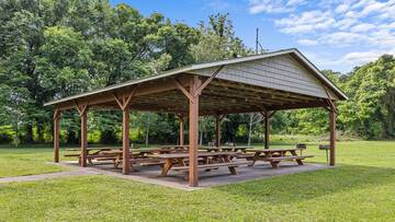 The family can enjoy picnics under the pavilion with several charcoal grills available. at River Waltz in Gatlinburg TN