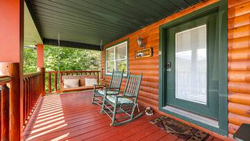 Take moments to relax on your cabin's porch swing or in the several rockers. at Bear Crossing in Gatlinburg TN