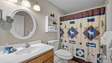 This is your cabin's second full bath with shower and tub combo. at Bear Crossing in Gatlinburg TN