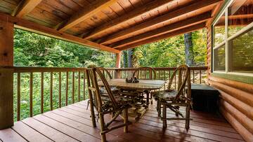 Enjoy dinner or breakfast in the Smoky Mountains on your cabin's porch.  at Bear Crossing in Gatlinburg TN