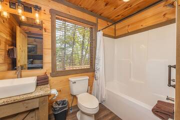 Upstairs bedroom full bath with farm wash basin. at The Appalachian in Gatlinburg TN