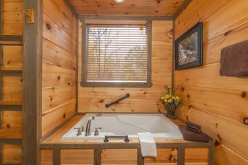 Second cabin bedroom's Jacuzzi tub for added relaxation.