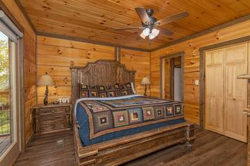 Rental cabin master bedroom on the main floor of The Appalachian. at The Appalachian in Gatlinburg TN