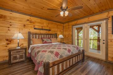 Rustic furnishings in your 5 bedroom cabin's second bedroom. 