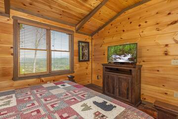 Televisions in each of the cabin's bedrooms provides late night entertainment. 