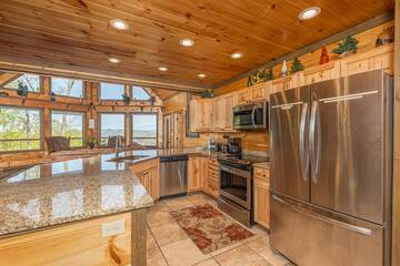 Fully equipped rental cabin kitchen with stainless steel appliances and lots of counter space. at The Appalachian in Gatlinburg TN
