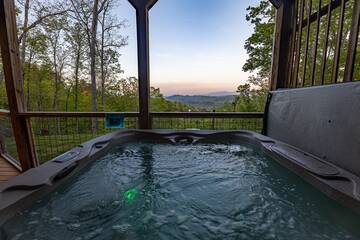 Watch the sunset from your rental cabin's hot tub. at The Appalachian in Gatlinburg TN